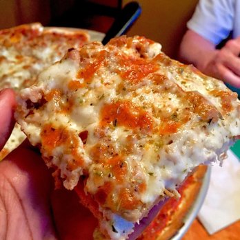 Oliva's Bar & Restaurant - Pizza slice: with herbs - Italian Near Me - Mishawaka, Indiana Oliva's Bar & Restaurant - Pizza slice: with herbs - Italian Near Me - Mishawaka, Indiana