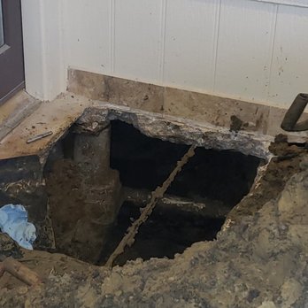 Bee Prestigious Plumbing - The hole dug to get to the slab leak. He had to work around a tension cable and another drain. - Plumbing Near Me Bee Prestigious Plumbing - The hole dug to get to the slab leak. He had to work around a tension cable and another drain. - Plumbing Near Me