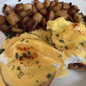 Jailhouse Cafe - Southwestern Eggs Benedict: one poached, one scrambled egg. Hollandaise sauce and potatoes have a little spice, definitely delicious. - Breakfast & Brunch Near Me - Moab, Utah