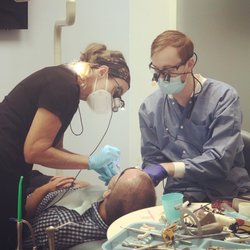 Dr. Jared Schmitt working with a patient at Seaglass Dental Care.