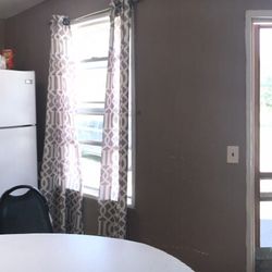 Black Rock Cottages - Pano of kitchen/living/trundle