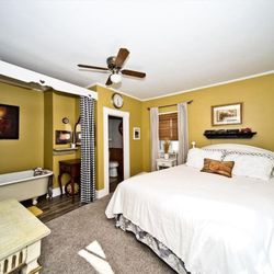 Whistle Stop Inn - The Conductor's Quarters has a cozy room with queen-size bed, claw foot tub and a private bathroom.