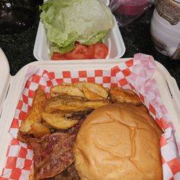 Half-pound bacon burger with fries.