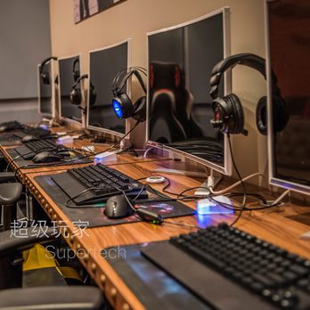 Super Tech - a row of computer monitors and gaming headsets - Internet Cafes Near Me - Markham, Ontario