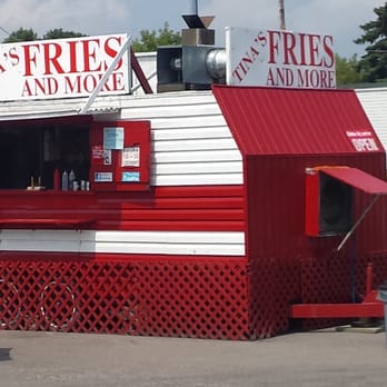 Tina's Fries and More - a woman sitting at a table - Food Trucks Near Me - Cobourg, Ontario Tina's Fries and More - a woman sitting at a table - Food Trucks Near Me - Cobourg, Ontario