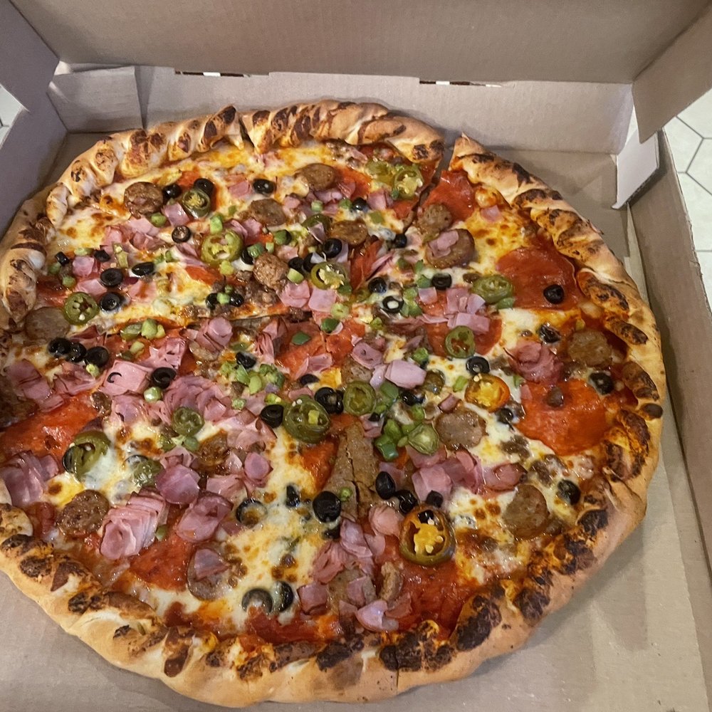 Matadors Pizzeria - Custom Pizza Pie - yummy golden baked crust with marina sauce, topped with jalapeños, olives, ham, sausage, pepperoni and mozzarella cheese - Pizza Near Me - Thackerville, Oklahoma Matadors Pizzeria - Custom Pizza Pie - yummy golden baked crust with marina sauce, topped with jalapeños, olives, ham, sausage, pepperoni and mozzarella cheese - Pizza Near Me - Thackerville, Oklahoma