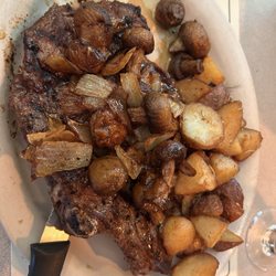 Juice's Ghost Town - 16 oz ribeye with grilled onions, mushrooms and potatoes.