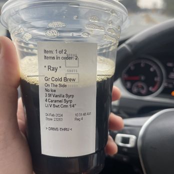 Starbucks - a hand holding a cup of cold brew - Coffee & Tea Near Me - Woodstock, Georgia Starbucks - a hand holding a cup of cold brew - Coffee & Tea Near Me - Woodstock, Georgia