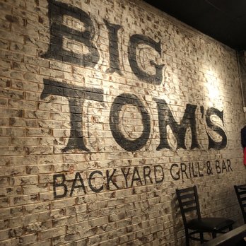 Big Tom's Backyard Grill & Bar - a brick wall - Bars Near Me - Cleveland, Tennessee