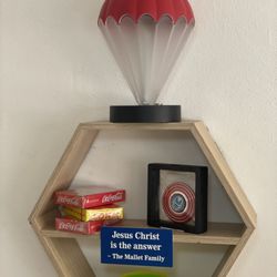 The Trophy Stop - The bookshelf sign created by Trophy Shop.