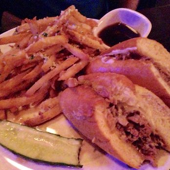 Marlow's Tavern - Prime rib french dip sandwich with truffle parmesan fries - New American Near Me - Orlando, Florida Marlow's Tavern - Prime rib french dip sandwich with truffle parmesan fries - New American Near Me - Orlando, Florida