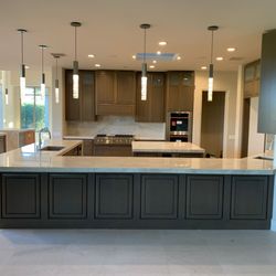 Countertops quartzite Taj Mahal and cabinets