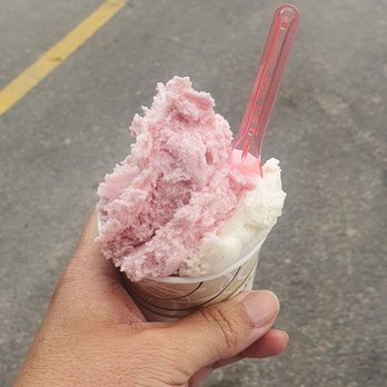 Pronto Cafe - a hand holding a pink ice cream cone - Cafes Near Me - Concord, Ontario