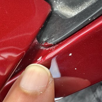 Tesla Collision - Overspray and chip or excessive clearcoat accumulatd on a nearby part - Body Shops Near Me - Orlando, Florida