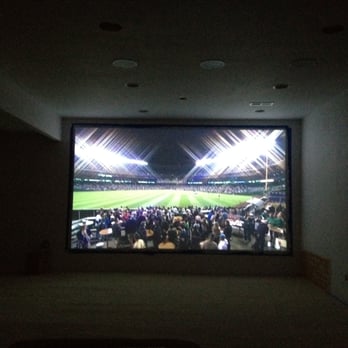 Encore Custom Theater - AFTER!  Fantastic right?  10' painted on the wall screen, with in ceiling speakers and infared controls.  Yeah.  WORTH IT! - Home Theatre Installation Near Me