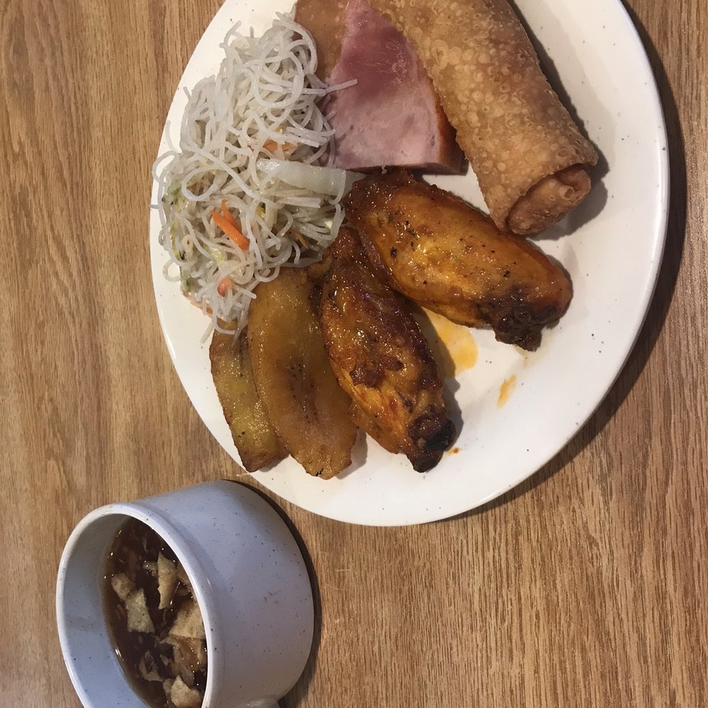 Nuevo China Buffet - Hot and sour soup. Clockwise on the plate: fried rice noodles, ham steak with gravy, spring roll, buffalo wings, and fried plantains. - Chinese Near Me - Northlake, Illinois