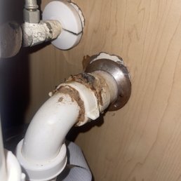 OLD MOLDED PIPES UNDER BATHROOM SINK