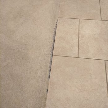 Performance Carpet Repair - a close up of a tile floor - Carpet Installation Near Me Performance Carpet Repair - a close up of a tile floor - Carpet Installation Near Me