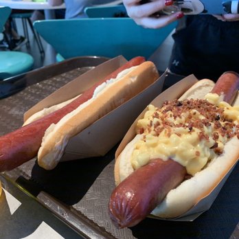 Cosmic Ray's Starlight Café - Two foot long hot dogs (plain on the left and mac and cheese on the right) - Sandwiches Near Me - Orlando, Florida