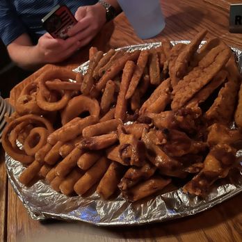 O'Hara's Restaurant and Pub - Platter featuring fried onion rings, fried zucchini, sticks, fried mozzarella sticks, chicken fingers, and chicken wings. - Irish Pub Near Me - New York, New York