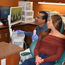 Ghosh Orthodontics - Dr. Ghosh discussing treatment with an orthodontic patient.