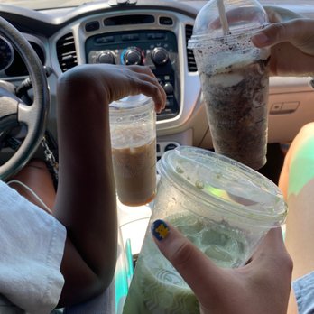 Starbucks - two people holding drinks in their hands - Coffee & Tea Near Me - Huntington Beach, California Starbucks - two people holding drinks in their hands - Coffee & Tea Near Me - Huntington Beach, California