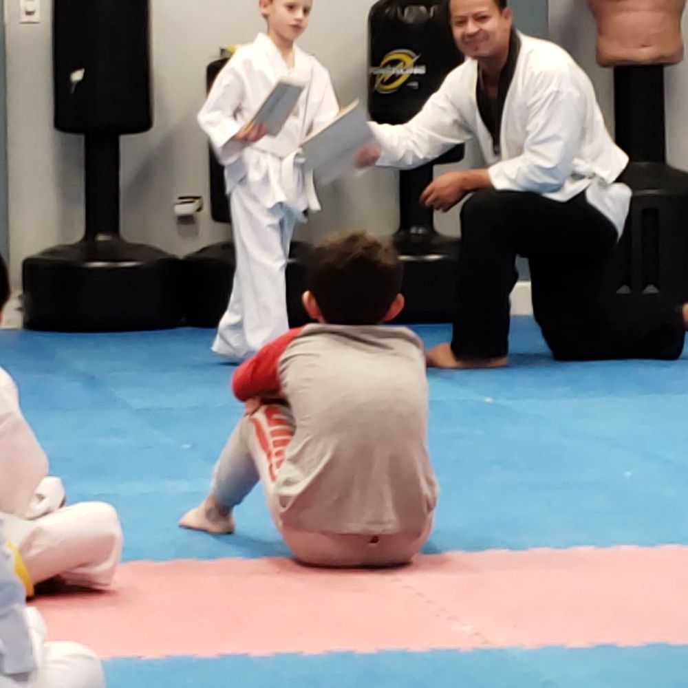 Chang's Martial Arts Academy - Eli gets his yellow belt from instructor David - Martial Arts Near Me - Chicago, Illinois Chang's Martial Arts Academy - Eli gets his yellow belt from instructor David - Martial Arts Near Me - Chicago, Illinois