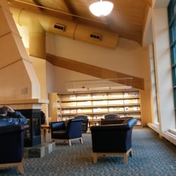 Milford Township Library - Adult reading area by fireplace - Milford Public Library.