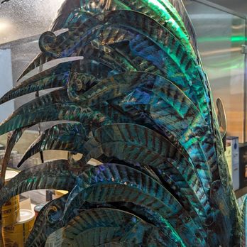 Ca Nuong Mien Tay - Rooster feathers made of metal - Vietnamese Near Me - Richardson, Texas