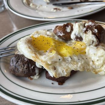 Dilly Diner - Perfectly over easy eggs enjoyed with skin on potatoes from the CHICKEN FRIED STEAK & EGGS - Sandwiches Near Me - Tulsa, Oklahoma Dilly Diner - Perfectly over easy eggs enjoyed with skin on potatoes from the CHICKEN FRIED STEAK & EGGS - Sandwiches Near Me - Tulsa, Oklahoma