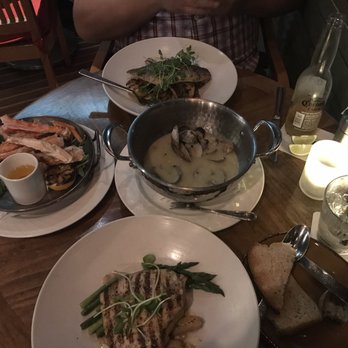 Schooners Monterey - Skillet Seared Branzino, King Crab Legs and (mostly eaten) Chardonnay Steamed Littleneck Clams, Swordfish Steak (customized) - Seafood Near Me - Monterey, California Schooners Monterey - Skillet Seared Branzino, King Crab Legs and (mostly eaten) Chardonnay Steamed Littleneck Clams, Swordfish Steak (customized) - Seafood Near Me - Monterey, California