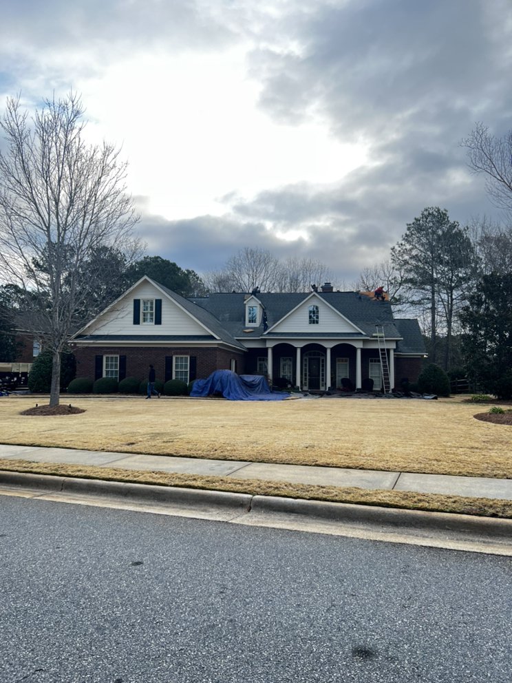 Slide of Ram's Roofing Service