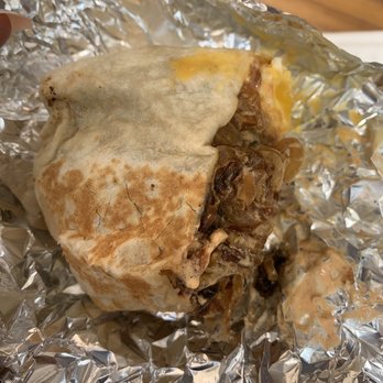 Component Coffee Lab - My half of the bacon bfast burrito. Over medium egg and chipotle cream sauce. They top it with caramelized onion. SOOO good. - Coffee & Tea Near Me - Visalia, California
