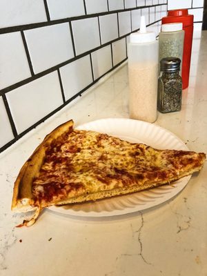 Photo of 2 Bros Pizza - New York, NY, US. Cheese slice