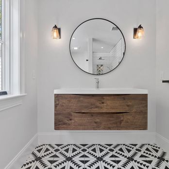 Gold Hill Builders - a bathroom with white walls and a black and white patterned floor - General Contractors Near Me - Northport, New York Gold Hill Builders - a bathroom with white walls and a black and white patterned floor - General Contractors Near Me - Northport, New York