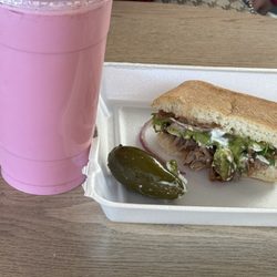 Carnitas Premium - Agua de fresa ..strawberry water , half a torta de carnitas