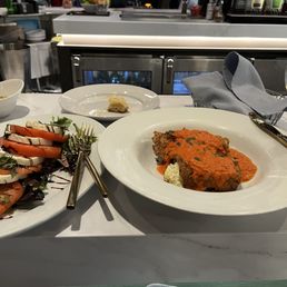 Caprese salad and eggplant rollitini.