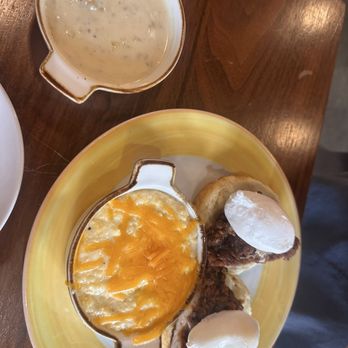Honeycomb Cafe - Chicken and biscuit Benedict with cheddar grits - New American Near Me - Belmont, North Carolina