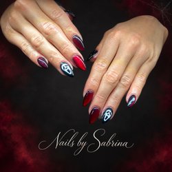 The Studio Salon & Massage Bar - Red Cat Eye Nails with Scream Mask