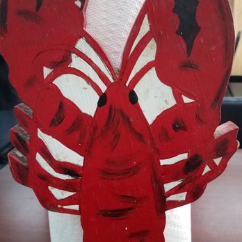 Johnny's Seafood - Love these kitschy lobster towel rolls on each table. - Seafood Markets Near Me - Marrero, Louisiana
