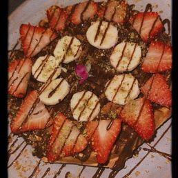 Strawberry banana waffle. I think Arabic style bc the flower and delicious high quality pistachios on it . Delicious Strawberry banana waffle. I think Arabic style bc the flower and delicious high quality pistachios on it . Delicious