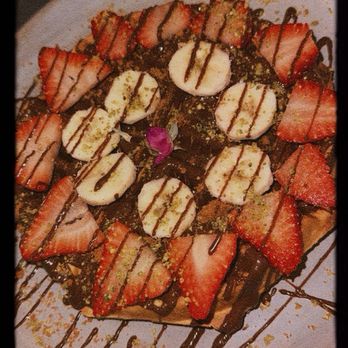 Peace Middle East Cafe - Strawberry banana waffle. I think Arabic style bc the flower and delicious high quality pistachios on it . Delicious - Desserts Near Me - Richardson, Texas Peace Middle East Cafe - Strawberry banana waffle. I think Arabic style bc the flower and delicious high quality pistachios on it . Delicious - Desserts Near Me - Richardson, Texas