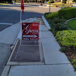 The Garcia Team - What gives a real-estate company the right to block a public sidewalk? Wheelchair users cannot pass.