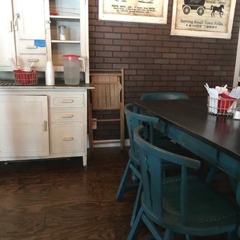 On the Square Bakery & Deli - Old chairs and tables and a cupboard in the dining area. - Bakeries Near Me - Eden, Texas