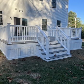 Hook & Ladder Contracting Services - a white deck with steps and railings - Decks & Railing Near Me - Litchfield, New Hampshire Hook & Ladder Contracting Services - a white deck with steps and railings - Decks & Railing Near Me - Litchfield, New Hampshire
