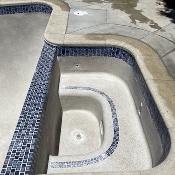 Premier Pool Plastering - Jacuzzi area. The next day, they did an acid wash to show off the blue pebbles and take off the white haze. - Pool & Hot Tub Service Near Me - Sylmar, California