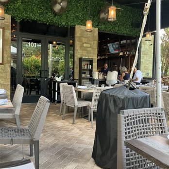 MIA Kitchen & Bar - Under the canopy outside - New American Near Me - Delray Beach, Florida