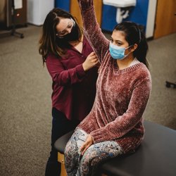 Star Physical Therapy Services - Fairfield - Dr. Laura, PT, assessing shoulder range of motion