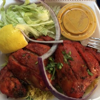 Hot N Spicy Restaurant - Chicken Tandoori, hidden under red onions...meat was tender and very tasty. - Indian Near Me - Irving, Texas