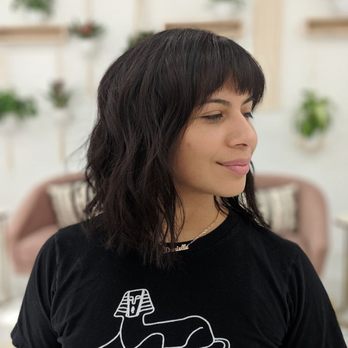 Trendy Blondes and Extensions - All over color with textured cut and bangs - Hair Stylists Near Me Trendy Blondes and Extensions - All over color with textured cut and bangs - Hair Stylists Near Me